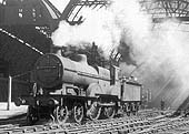 Ex-Midland Railway 2P 4-4-0 No 512 is seen on the middle road between Platforms 9 and 10 whilst acting as station pilot engine