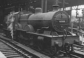 Ex-LMS 4P 4-4-0 Compound No 40928 stands light engine on the middle road between Platforms 7 and 8 at the West end of the station