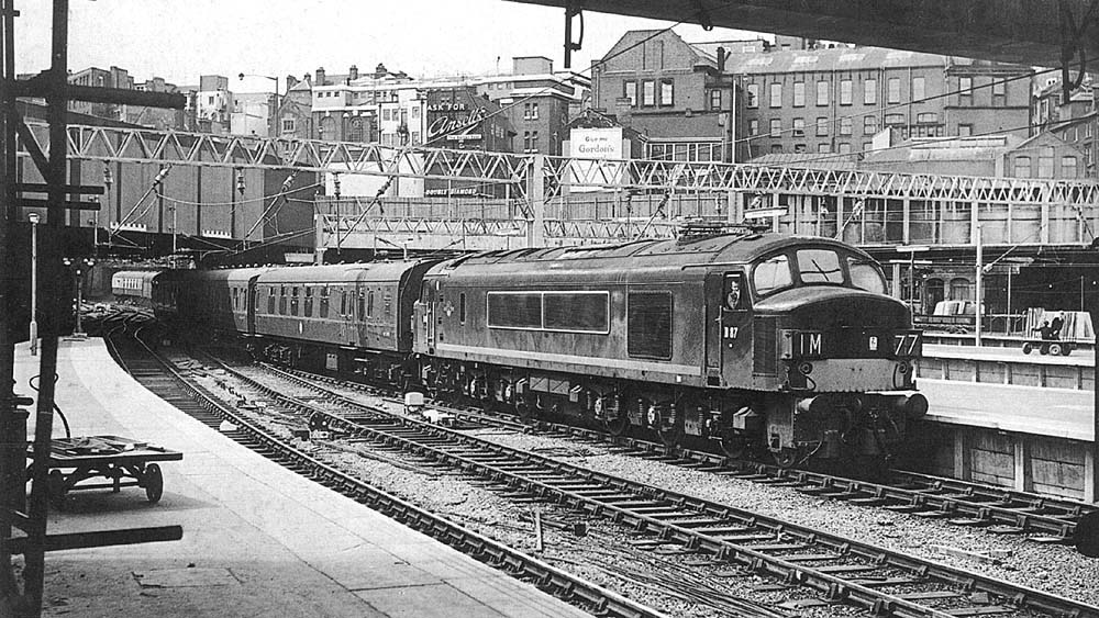 British Railways Type 4 1Co-Co1 D87 is seen entering a nearly complete New Street station's Platform 9 with the 08 35am Pembroke to Derby service