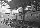 British Railways Type 4 1Co-Co1 D292 is seen being detached from the Southbound Pines Express on Saturday 23rd December 1961