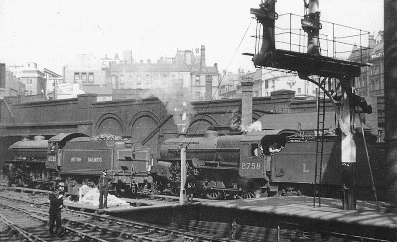 Ex-LNER 4-6-0 'B1' No 61325 and ex-LMS 5P4F 2-6-0 'Crab' No 2758 are seen from Platform 10 at the West End of New Street station during April 1949