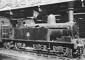 Ex-LNWR 2F 0-6-2T No 58900 is on pilot duties when its seen on the up middle road between Platforms 3 and 4 shunting stock on 25th August 1953