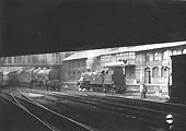 Ex-LMS 4-6-0 Patriot class No 45543 'Home Guard' is seen passing ex-LMS 3MT 2-6-2T No 40129 between Navigation and Hill Street bridges