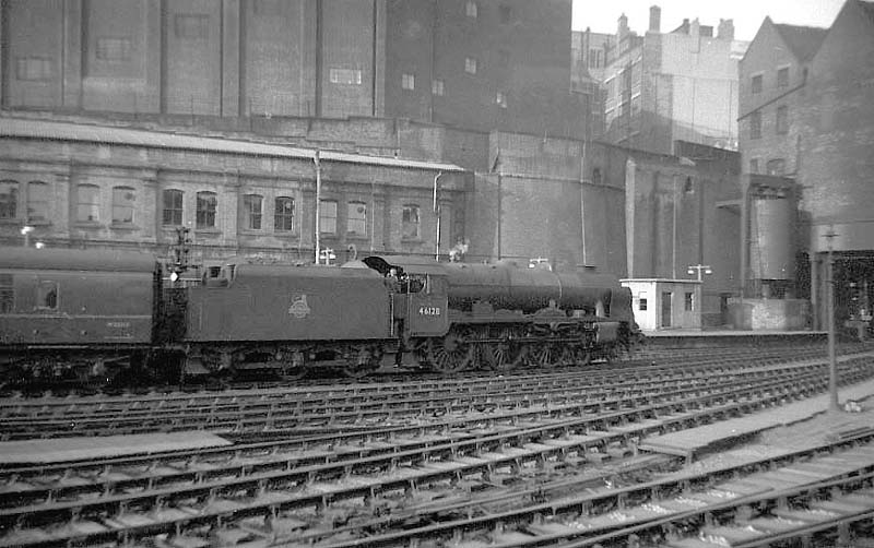 Ex-LMS 6P Rebuilt Royal Scot Class 4-6-0 No 46128 'Lovatt Scouts' departs platform 3 on an up express in 1957