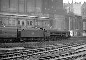 Ex-LMS 6P Rebuilt Royal Scot Class 4-6-0 No 46128 'Lovatt Scouts' departs platform 3 on an up express in 1957