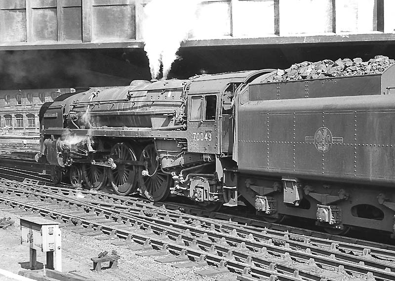 British Railways Standard Class 7MT 4-6-2 No 70043 'Lord Kitchener' departs New Street station on a down express on 27th July 1963