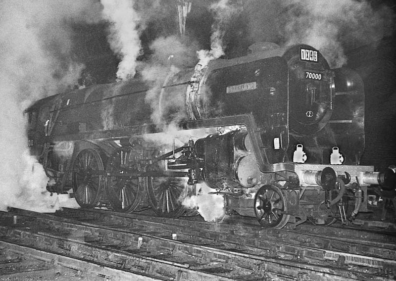 British Railways Standard Class 7MT 4-6-2 No 70000 'Britannia' is seen wreathed in steam on the evening of 18th January 1964