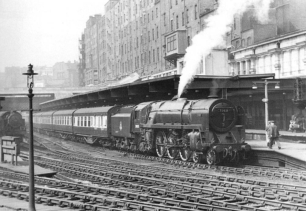 British Railways Standard Class 7MT 4-6-2 No 70031 'Byron' is about to depart platform 3 with an up express on 20th April 1955