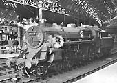 British Railways Type 4 1-Co-Co1 D94 is seen standing at Platform 9 ready to depart with the 12 52pm York to Bristol express on 8th June 1961