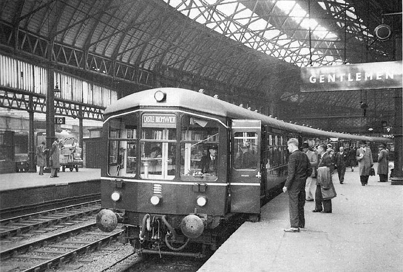 An evening commuter Diesel Multiple Unit waits to depart from platform 9 for Castle Bromwich in the late 1950s