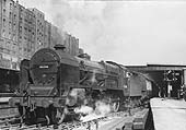 Ex-LMS 5XP 4-6-0 Patriot class No 45506 The Royal Pioneer Corps' is seen departing the West end of Platform 6 at the head of a Wolverhampton express