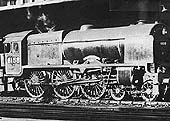 Ex-LMS 6P 4-6-0 Royal Scot class No 6158 'The Loyal Regiment' is seen standing at Platform 3 on a Glasgow to Birmingham express