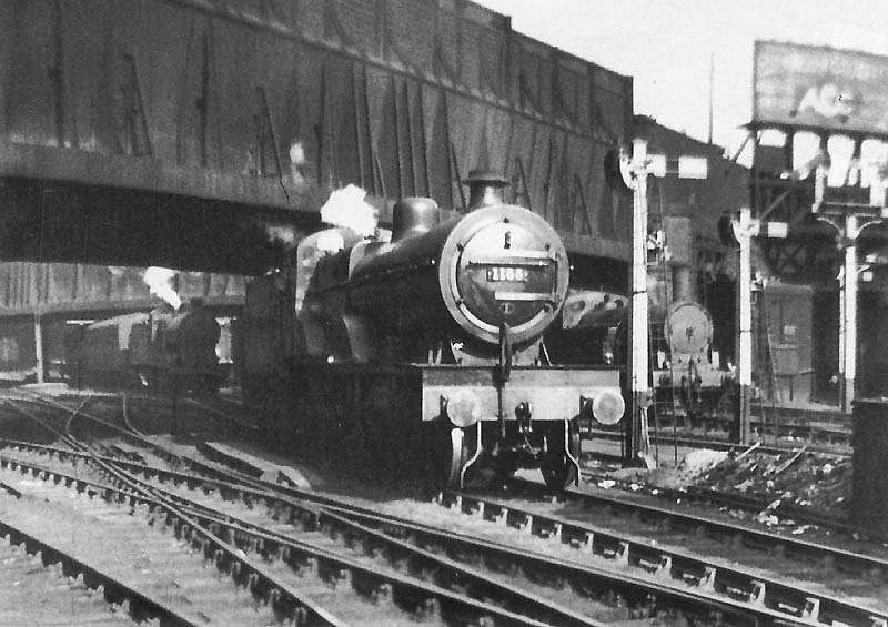 LMS 4P 4-4-0 Compound No 1155 is seen stopped at signals by New Street No 5 Signal Cabin after passing under Hill Street bridge as a light engine