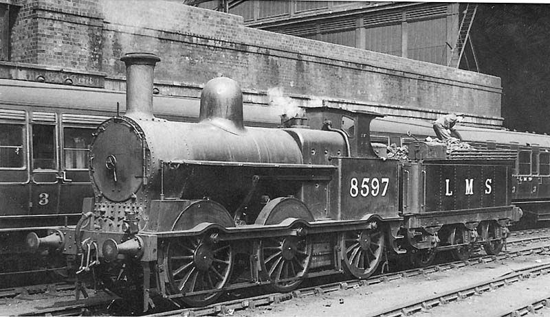 Ex-LNWR 2F 0-6-0 18in Goods Engine No 8597 pauses between pilot duties at the West end of New Street station as the fireman checks the rear of the tender