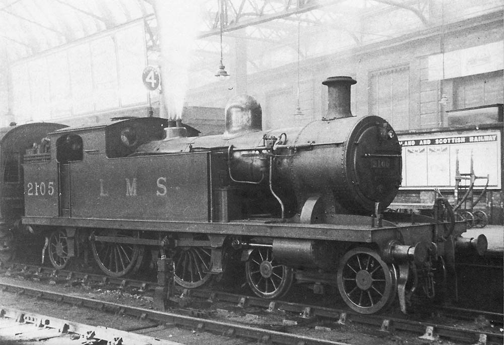 Ex-LTSR 2P 4-4-2T No 2105, known to local enthusiasts as a 'Tilbury Tank', is seen standing at the East end of Platform 4 at the head of a local passenger service