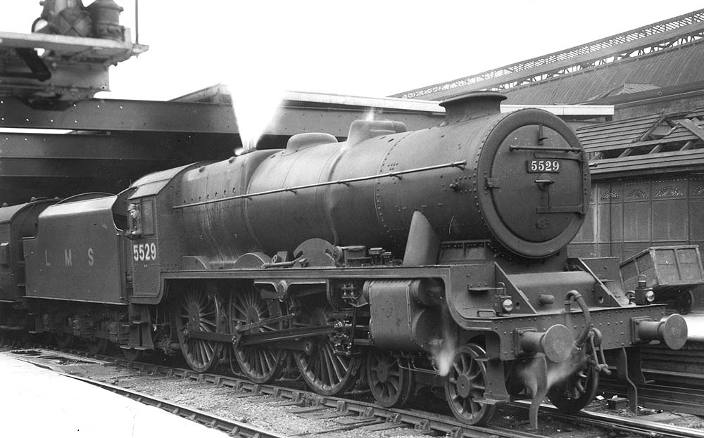 LMS 6P 4-6-0  Converted Patriot class No 5529 is seen blowing off steam whilst standing at Platform 3 at the head of a down express service