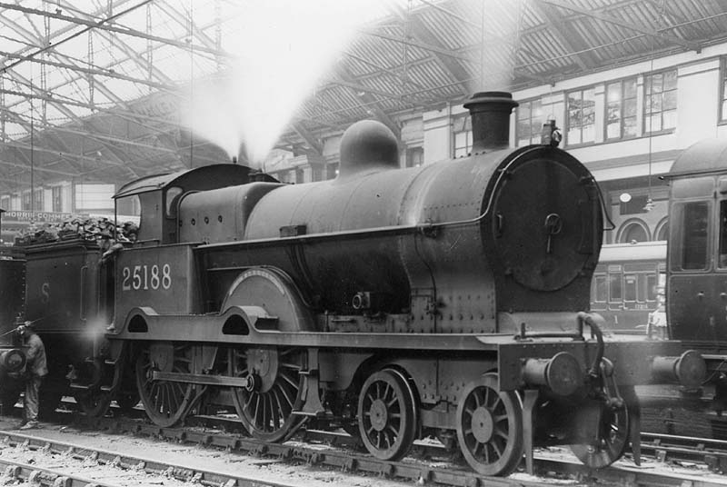 Ex-LNWR 3P 4-4-0 Precursor class No 25188 'Marquis' is seen standing on the centre road between Platforms 1 and 2 whilst waiting for its coaching stock to arrive