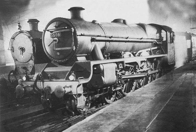 LMS 5XP 4-6-0 Jubilee class No 5556 is seen at night wreathed in steam whist standing at the West end of Platform 2 at the head of a Wolverhampton service