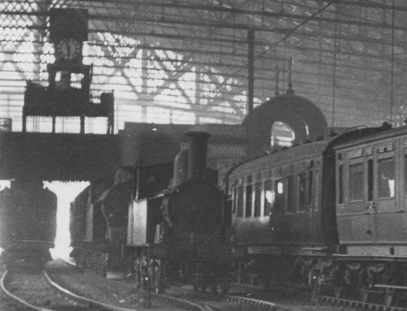 Close up showing an unidentified ex-LNWR 0-6-2T Watford Tank locomotive and an ex-LNWR 4-4-2T Precursor tank locomotive standing on the middle road