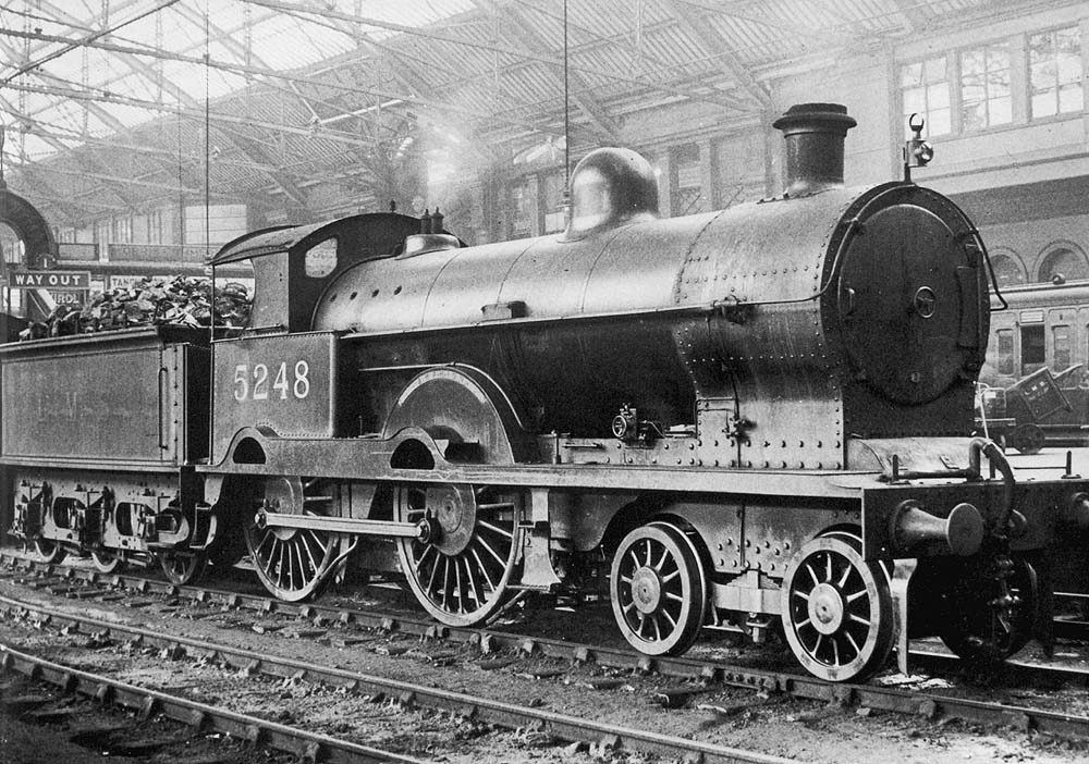 Ex-LNWR 3P 4-4-0 Precursor class No 5248 'Amphion' is seen standing on the centre road between Platforms 1 and 2 prior to forming a train for Stafford