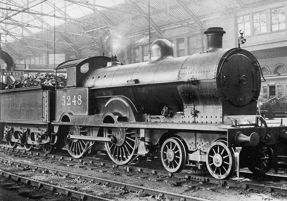 Ex-LNWR 3P 4-4-0 Precursor class No 5248 'Amphion' is seen standing on the centre road between Platforms 1 and 2 prior to forming a train for Stafford