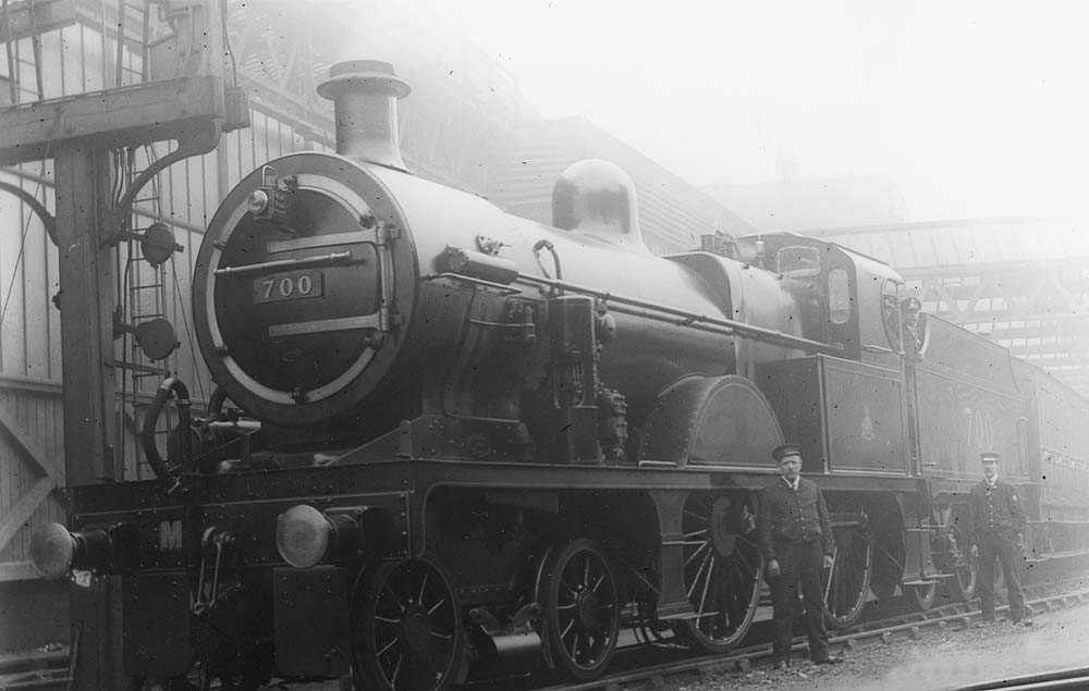 Close up showing the locomotive crew of Midland Railway 4-4-0 No 547 checking that the locomotive is perfectly balanced on the 45 ft diameter turntable