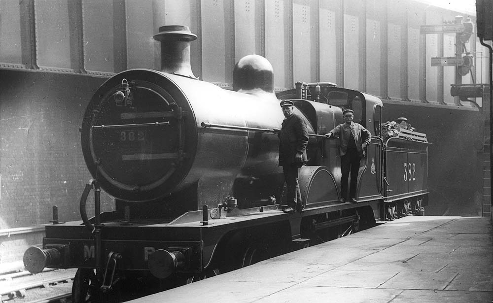 Midland Railway 2P 4-4-0 No 382 is seen whilst on Pilot duties standing at the East end of Platform 5 alongside No 2 Signal Box  with Queens Drive bridge behind