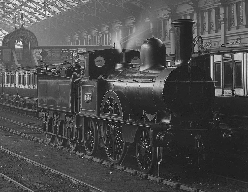 Close up showing LNWR 2-2-2 'Small Bloomer' No 1816 'Vandal' standing on one of the centre roads with its smokebox lamp turned sideways