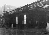 Another view of the entrance from Station Street showing posters advertising tickets to Aintree, Edinburgh and Bolton