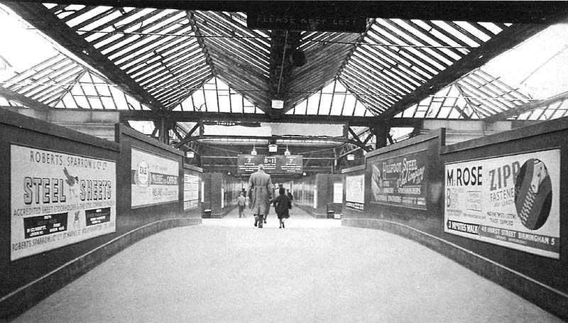 View of the passenger footbridge as it crosses over Queens Drive looking towards Platforms 7 to 11 in the Midland section of New Street station