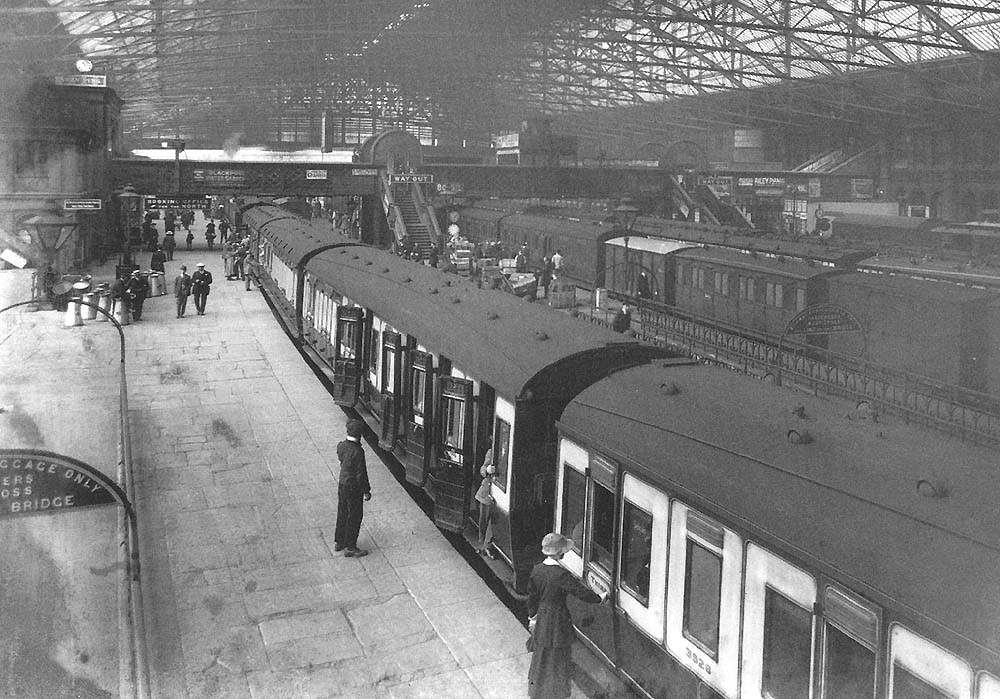 Looking West along Platform 3 with on the right a rake of LNWR 57 ft lavatory stock coaches built during the First World War period