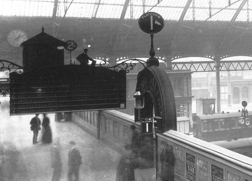 Close up showing the top of the steps to Western section of Platform 1 with a signalman standing on duty at New Street No 3 Signal Cabin