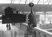 Close up showing the top of the steps to Western section of Platform 1 with a signalman standing on duty at New Street No 3 Signal Cabin