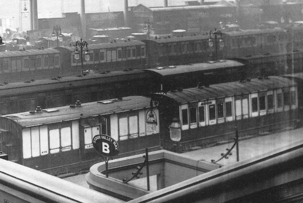 Close up showing the Stour Valley Bay sign and some six-wheel coaching stock standing on the Western portion of Platform One