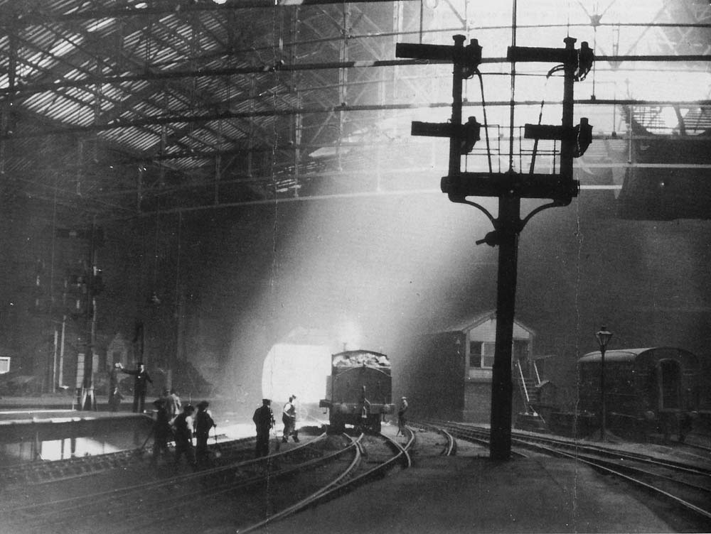 Looking towards Worcester Street tunnel with an unidentified ex-LNWR 0-6-2T locomotive passing New Street No 1 Signal Box and a gang of Permanent Way workers