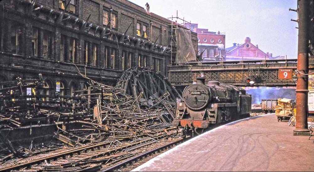 BR Standard Class 5MT 4-6-0 No 73019 pauses between duties whilst working on an Civil Engineers trip at Birmingham New Street Station in demolition on 26th May 1964