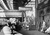 View looking West of the steps leading off Platform 7 up to the pedestrian footbridge in 1954