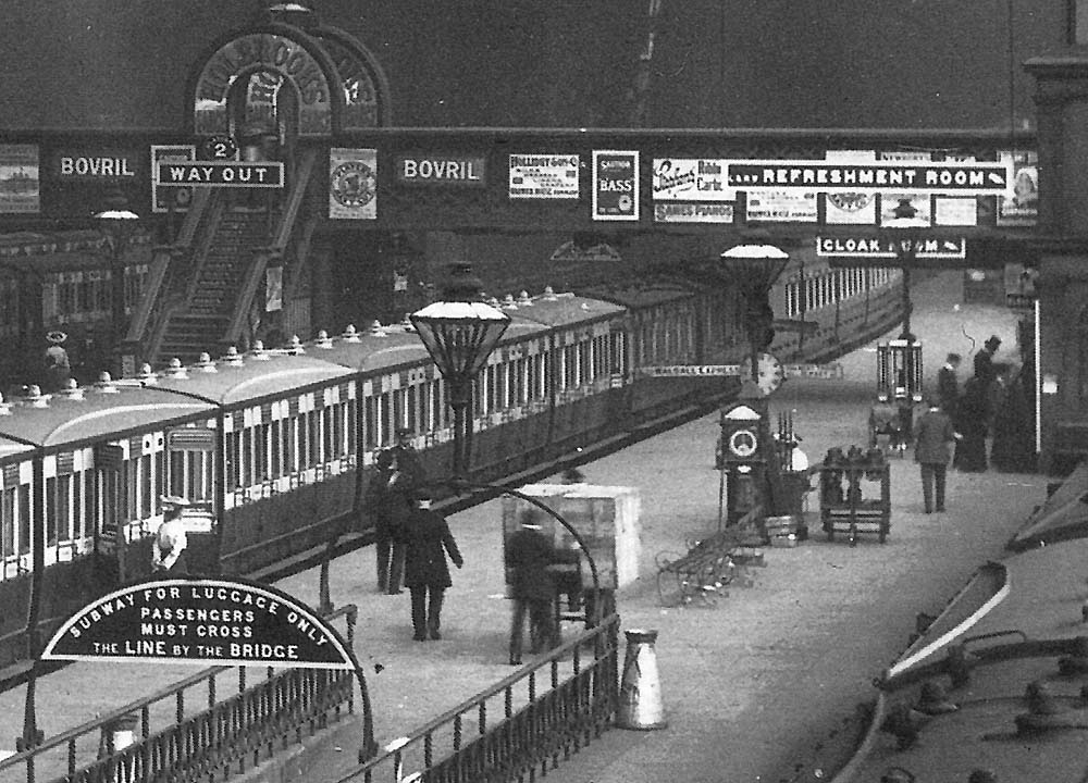 Close up showing passengers standing by the station's Cloak Room on  Platform 3 as the train to Walsall waits to depart