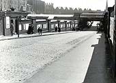 Looking Eastwards along Queens Drive towards the entrance to the portions of the station in 1952