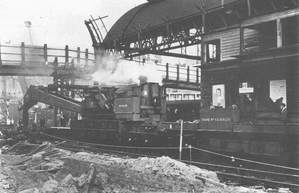 Willesden Steam Breakdown Crane is seen assisting in the demolition of the MR side of New Street station in 1965