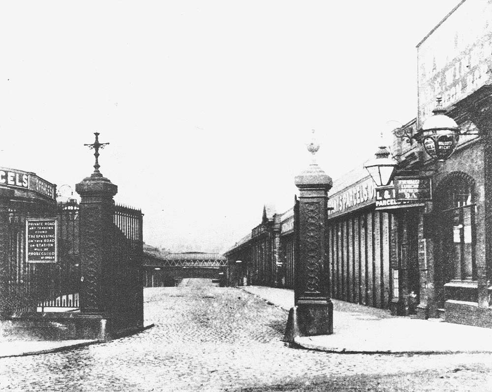 Entrance to Queens Drive from the southern end, opposite the Market Hall, with the MR parcels office on the left and the LNWR parcels office on the right
