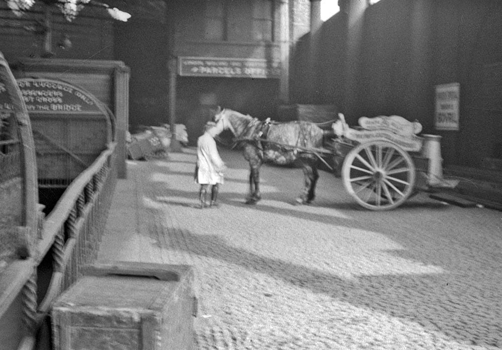 The Wathes owned cart is performing a tight turn on the ramp to the parcels and produce dock in New Street station