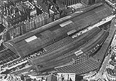 Aerial view of New Street station showing the juxtaposition of the 1885 extension to the original 1854 LNWR station and and the covered section of Queens Drive linking both