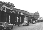 Looking along Station Street towards Worcester Street and the former Midland Railway's parcel offices with the entrances to the station on the left