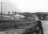 View from the Wolverhampton end of Platform 6, formerly Platform 3, showing the station canopies over the platforms and Queens Hotel towering above on the left