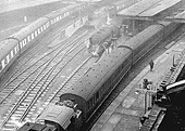 An elevated view of the East end of New Street station and Platforms 1, 2, 3 and 4 showing a local passenger train departing for Coventry