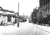 Looking towards the Market Hall along Station Street now with a cobbled surface and electrified tram lines and new buildings in filling the gaps
