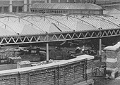 Close up showing the wagons being used on the remaining construction work which was still being undertaken a few months after the station had been opened for traffic