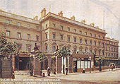 A coloured postcard looking from Stephenson Place showing the entrance to the private road in front of the Queen's & North Western Hotel