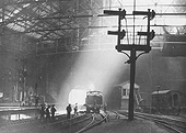 Looking towards Worcester Street tunnel with an unidentified ex-LNWR 0-6-2T locomotive passing New Street No 1 Signal Box and a gang of Permanent Way workers